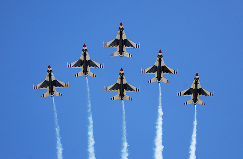 The U.S. Air Force Thunderbirds perform a 6-ship formation fly over during an airshow. U.S. Air Force photo by Senior Airman Michael Frye